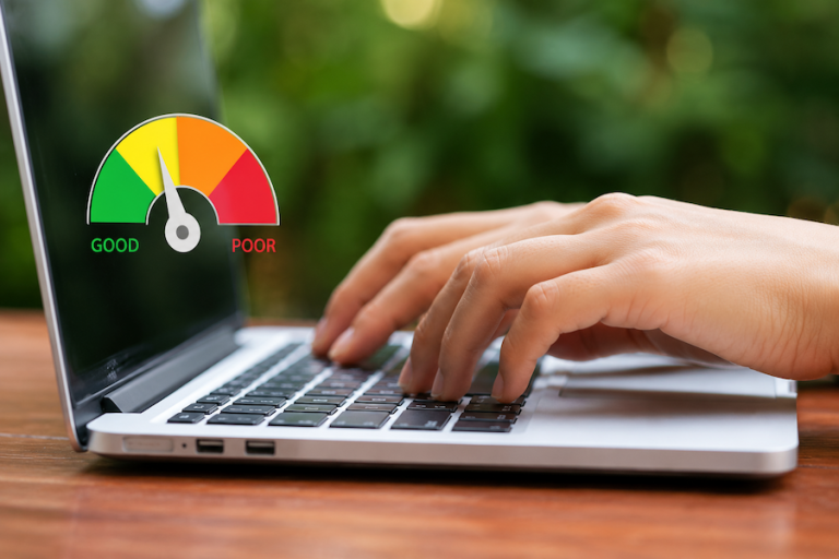 Person typing with a graph showing