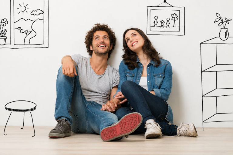 Couple sitting against the wall