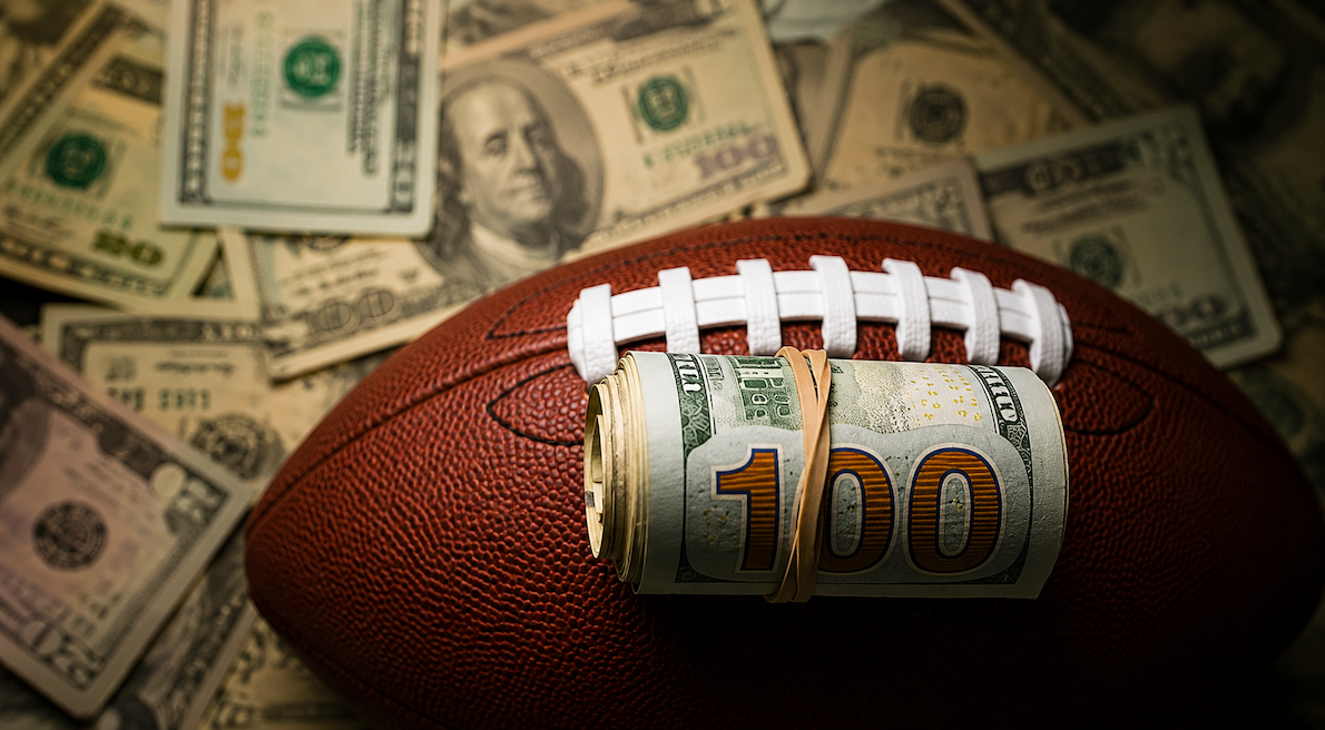 Football with money around it