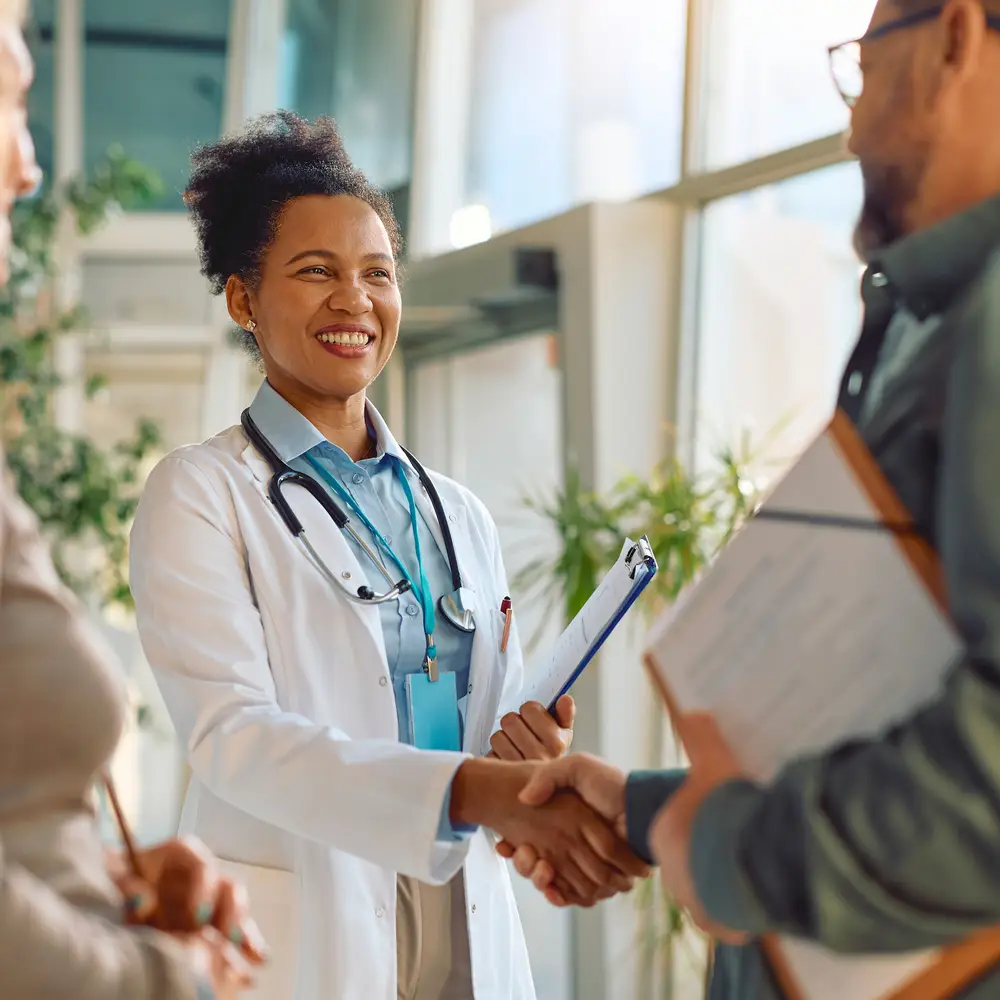Doctor shaking hands with a patient