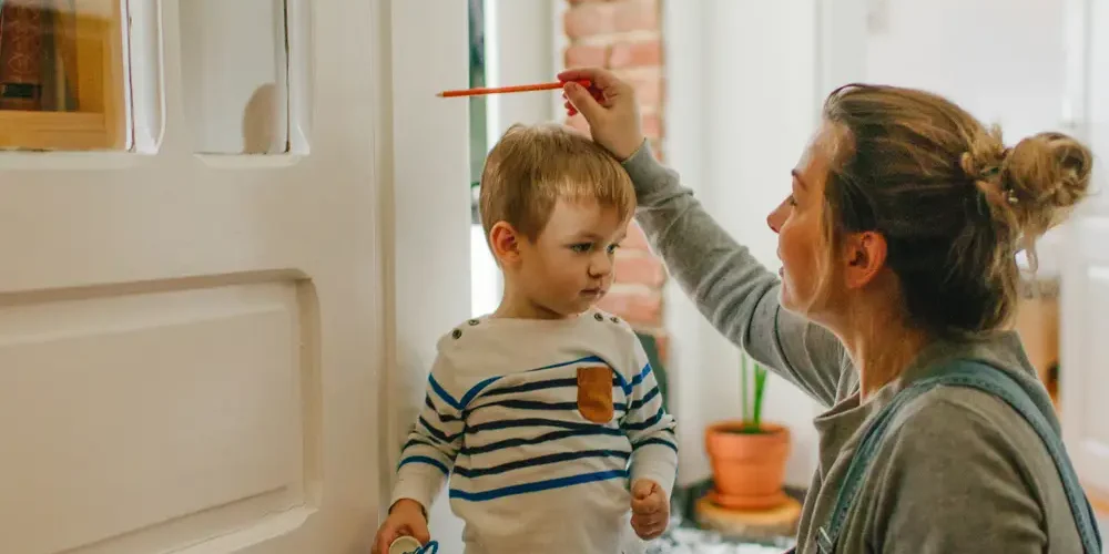 Boy being measured for growth